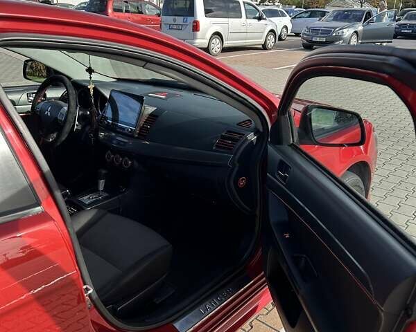 Красный Мицубиси Лансер, объемом двигателя 2 л и пробегом 227 тыс. км за 7000 $, фото 14 на Automoto.ua