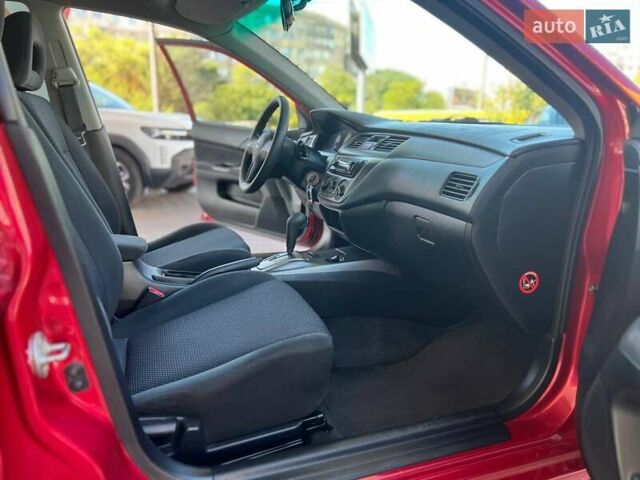 Червоний Міцубісі Lancer, об'ємом двигуна 1.58 л та пробігом 223 тис. км за 6400 $, фото 12 на Automoto.ua