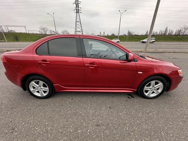 Красный Мицубиси Лансер, объемом двигателя 2 л и пробегом 366 тыс. км за 6500 $, фото 3 на Automoto.ua