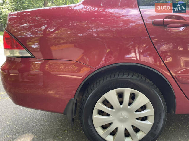 Червоний Міцубісі Lancer, об'ємом двигуна 1.6 л та пробігом 270 тис. км за 5699 $, фото 18 на Automoto.ua