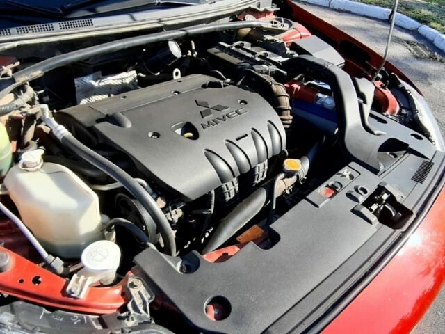 Красный Мицубиси Лансер, объемом двигателя 2 л и пробегом 110 тыс. км за 7500 $, фото 9 на Automoto.ua