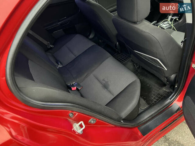 Красный Мицубиси Лансер, объемом двигателя 2 л и пробегом 330 тыс. км за 5250 $, фото 7 на Automoto.ua