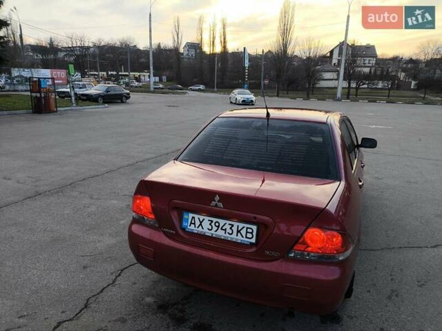 Червоний Міцубісі Lancer, об'ємом двигуна 1.58 л та пробігом 140 тис. км за 6000 $, фото 6 на Automoto.ua