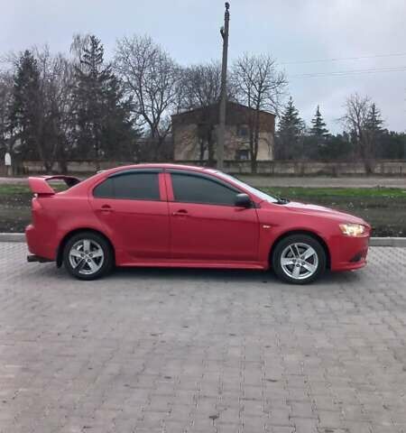 Красный Мицубиси Лансер, объемом двигателя 2 л и пробегом 200 тыс. км за 6000 $, фото 3 на Automoto.ua