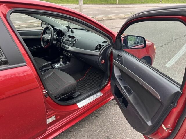 Красный Мицубиси Лансер, объемом двигателя 2 л и пробегом 366 тыс. км за 6500 $, фото 9 на Automoto.ua