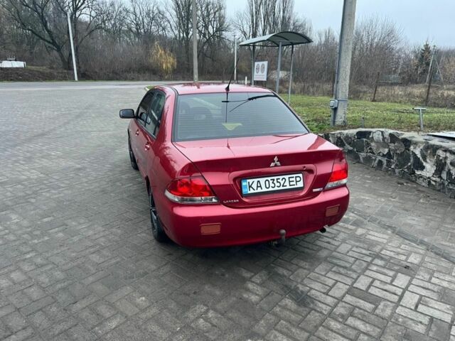 Красный Мицубиси Лансер, объемом двигателя 1.6 л и пробегом 265 тыс. км за 2956 $, фото 13 на Automoto.ua