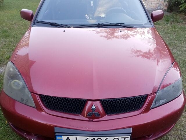 Червоний Міцубісі Lancer, об'ємом двигуна 1.6 л та пробігом 240 тис. км за 2030 $, фото 7 на Automoto.ua