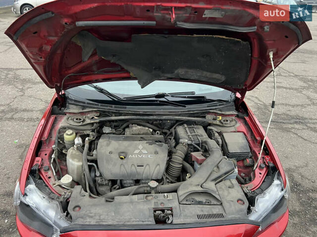 Красный Мицубиси Лансер, объемом двигателя 2 л и пробегом 330 тыс. км за 5250 $, фото 1 на Automoto.ua