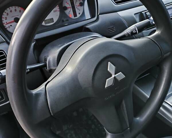 Червоний Міцубісі Lancer, об'ємом двигуна 1.58 л та пробігом 140 тис. км за 6000 $, фото 30 на Automoto.ua