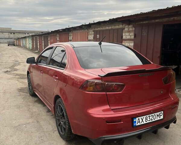 Червоний Міцубісі Lancer, об'ємом двигуна 2 л та пробігом 209 тис. км за 6900 $, фото 4 на Automoto.ua