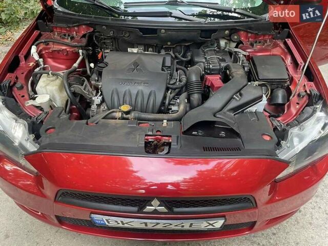 Красный Мицубиси Лансер, объемом двигателя 1.5 л и пробегом 124 тыс. км за 7100 $, фото 1 на Automoto.ua