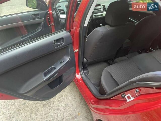 Красный Мицубиси Лансер, объемом двигателя 1.5 л и пробегом 124 тыс. км за 7100 $, фото 4 на Automoto.ua