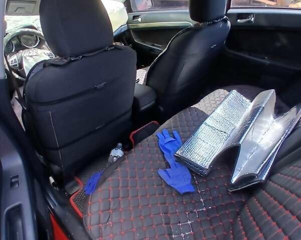 Красный Мицубиси Лансер, объемом двигателя 2 л и пробегом 192 тыс. км за 3000 $, фото 1 на Automoto.ua