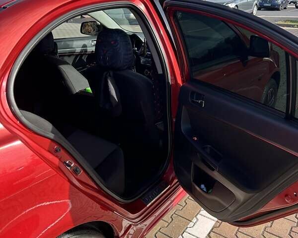 Красный Мицубиси Лансер, объемом двигателя 2 л и пробегом 227 тыс. км за 7000 $, фото 13 на Automoto.ua