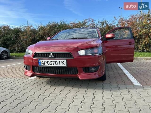 Красный Мицубиси Лансер, объемом двигателя 2 л и пробегом 227 тыс. км за 7000 $, фото 9 на Automoto.ua