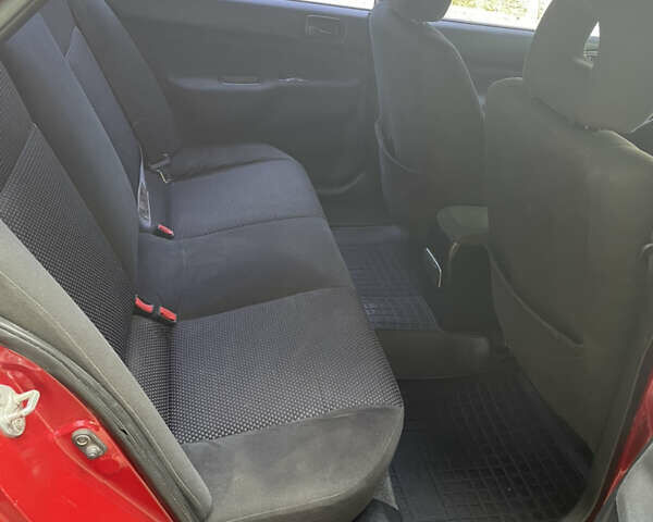Червоний Міцубісі Lancer, об'ємом двигуна 1.6 л та пробігом 270 тис. км за 5699 $, фото 59 на Automoto.ua