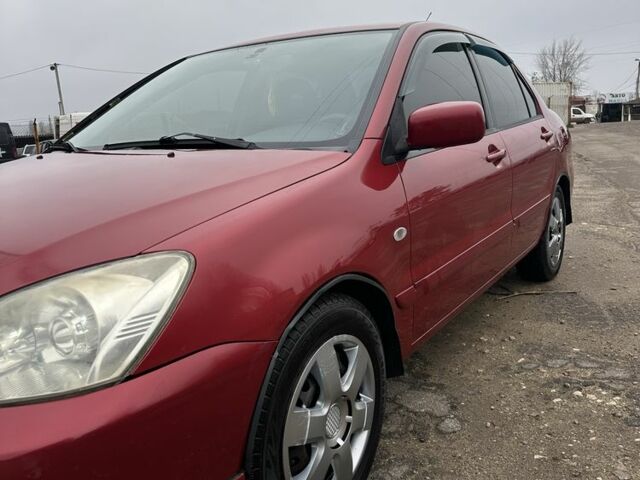 Червоний Міцубісі Lancer, об'ємом двигуна 1.6 л та пробігом 224 тис. км за 4300 $, фото 2 на Automoto.ua