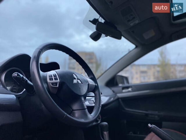 Красный Мицубиси Лансер, объемом двигателя 1.5 л и пробегом 120 тыс. км за 7699 $, фото 6 на Automoto.ua