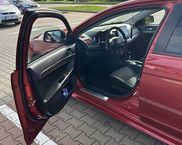 Красный Мицубиси Лансер, объемом двигателя 2 л и пробегом 227 тыс. км за 7000 $, фото 10 на Automoto.ua