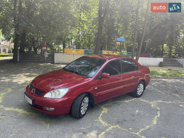Червоний Міцубісі Lancer, об'ємом двигуна 1.6 л та пробігом 270 тис. км за 5699 $, фото 1 на Automoto.ua