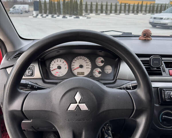 Красный Мицубиси Лансер, объемом двигателя 1.6 л и пробегом 276 тыс. км за 4550 $, фото 8 на Automoto.ua