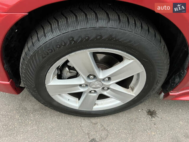 Красный Мицубиси Лансер, объемом двигателя 2 л и пробегом 330 тыс. км за 5250 $, фото 2 на Automoto.ua