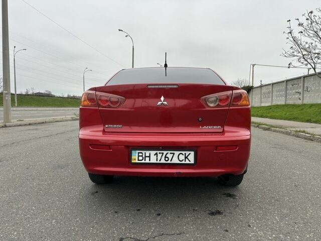 Красный Мицубиси Лансер, объемом двигателя 2 л и пробегом 366 тыс. км за 6500 $, фото 4 на Automoto.ua