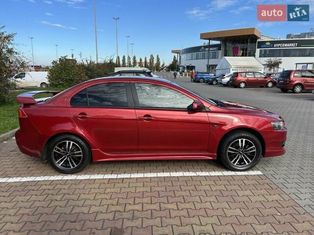 Красный Мицубиси Лансер, объемом двигателя 2 л и пробегом 227 тыс. км за 7000 $, фото 6 на Automoto.ua