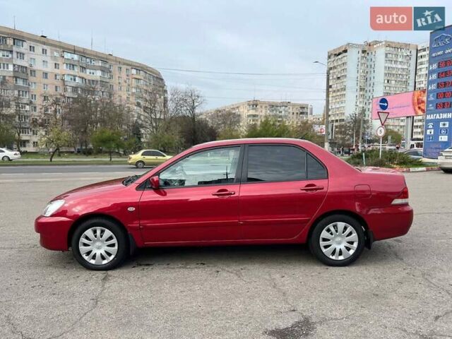 Червоний Міцубісі Lancer, об'ємом двигуна 1.58 л та пробігом 223 тис. км за 6400 $, фото 8 на Automoto.ua