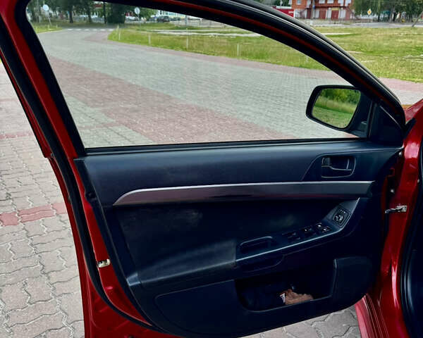 Красный Мицубиси Лансер, объемом двигателя 2 л и пробегом 365 тыс. км за 5000 $, фото 15 на Automoto.ua