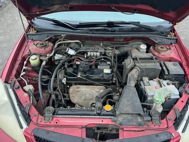 Красный Мицубиси Лансер, объемом двигателя 1.6 л и пробегом 265 тыс. км за 2956 $, фото 9 на Automoto.ua