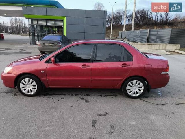 Червоний Міцубісі Lancer, об'ємом двигуна 1.58 л та пробігом 140 тис. км за 6000 $, фото 1 на Automoto.ua