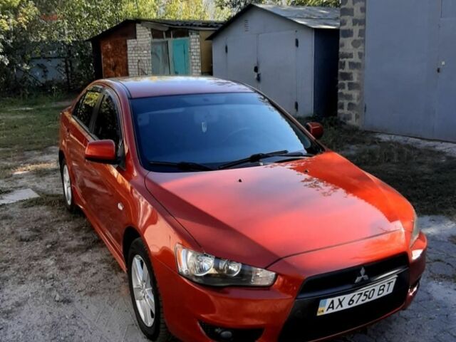 Красный Мицубиси Лансер, объемом двигателя 2 л и пробегом 110 тыс. км за 7500 $, фото 3 на Automoto.ua