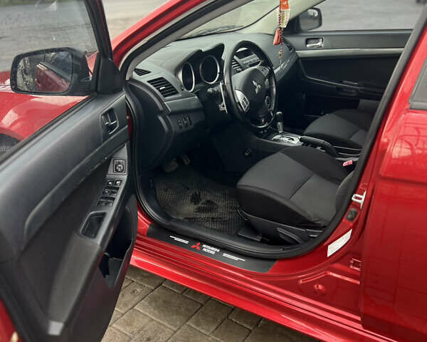 Червоний Міцубісі Lancer, об'ємом двигуна 2 л та пробігом 150 тис. км за 7000 $, фото 8 на Automoto.ua