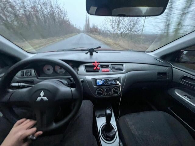 Красный Мицубиси Лансер, объемом двигателя 1.6 л и пробегом 265 тыс. км за 2956 $, фото 12 на Automoto.ua