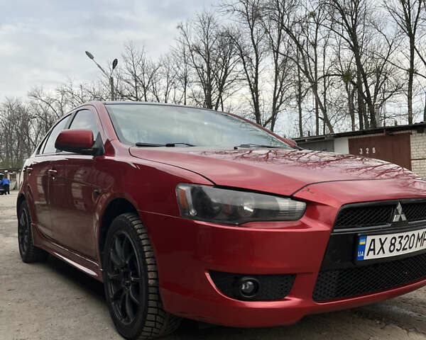 Червоний Міцубісі Lancer, об'ємом двигуна 2 л та пробігом 209 тис. км за 6900 $, фото 2 на Automoto.ua