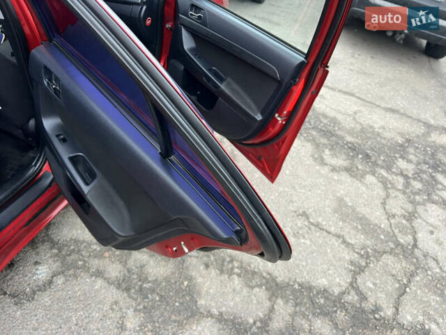 Красный Мицубиси Лансер, объемом двигателя 2 л и пробегом 330 тыс. км за 5250 $, фото 6 на Automoto.ua