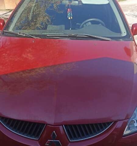 Мицубиси Лансер 2008 в Львове на Automoto.ua Красный Мицубиси Лансер, объемом двигателя 1.58 л и пробегом 280 тыс. км за 3200 $, фото 26 на Automoto.ua