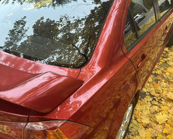 Червоний Міцубісі Lancer, об'ємом двигуна 2 л та пробігом 203 тис. км за 8000 $, фото 25 на Automoto.ua
