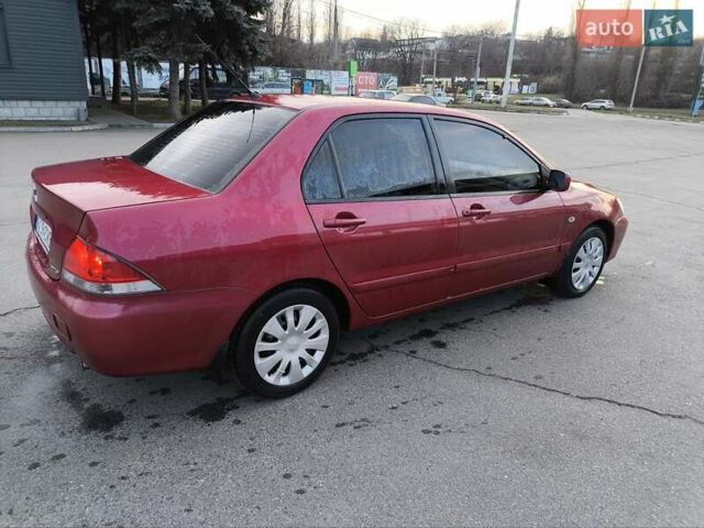 Червоний Міцубісі Lancer, об'ємом двигуна 1.58 л та пробігом 140 тис. км за 6000 $, фото 5 на Automoto.ua