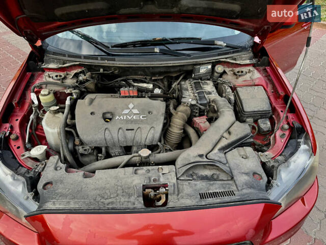 Красный Мицубиси Лансер, объемом двигателя 2 л и пробегом 365 тыс. км за 5000 $, фото 30 на Automoto.ua