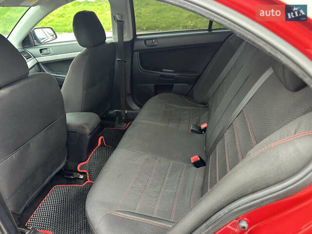Червоний Міцубісі Lancer, об'ємом двигуна 2 л та пробігом 366 тис. км за 6500 $, фото 9 на Automoto.ua