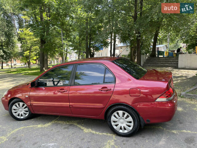 Червоний Міцубісі Lancer, об'ємом двигуна 1.6 л та пробігом 270 тис. км за 5699 $, фото 9 на Automoto.ua