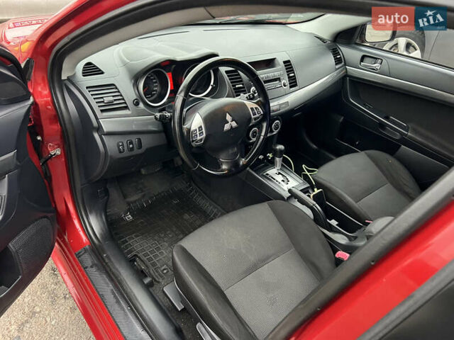 Красный Мицубиси Лансер, объемом двигателя 2 л и пробегом 330 тыс. км за 5250 $, фото 16 на Automoto.ua