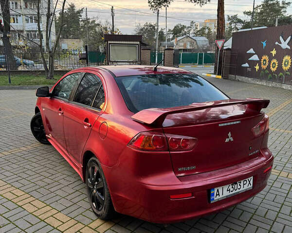 Красный Мицубиси Лансер, объемом двигателя 2 л и пробегом 143 тыс. км за 5200 $, фото 11 на Automoto.ua