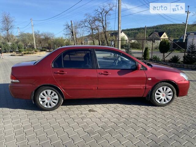 Червоний Міцубісі Lancer, об'ємом двигуна 0 л та пробігом 160 тис. км за 4244 $, фото 30 на Automoto.ua