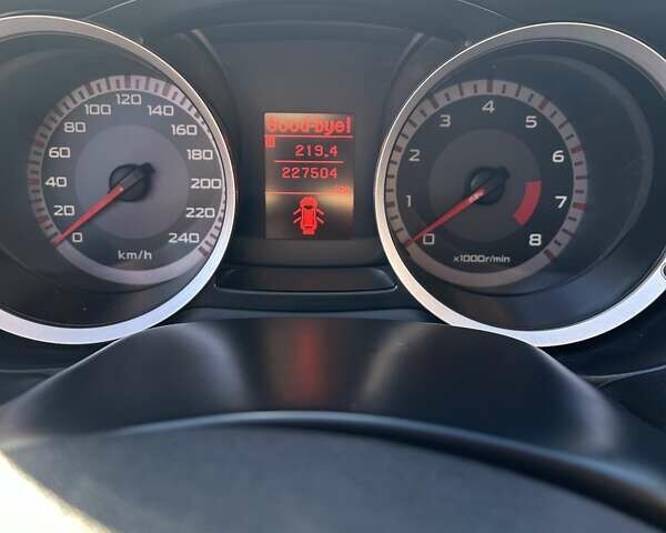 Красный Мицубиси Лансер, объемом двигателя 2 л и пробегом 227 тыс. км за 7000 $, фото 21 на Automoto.ua