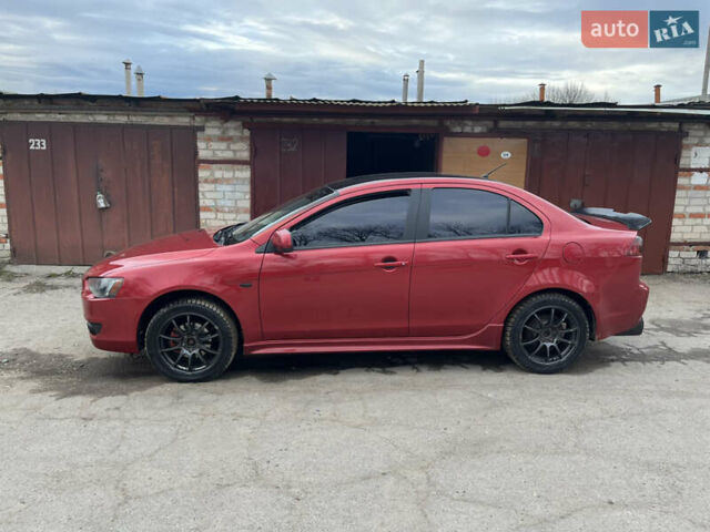 Червоний Міцубісі Lancer, об'ємом двигуна 2 л та пробігом 209 тис. км за 6900 $, фото 1 на Automoto.ua