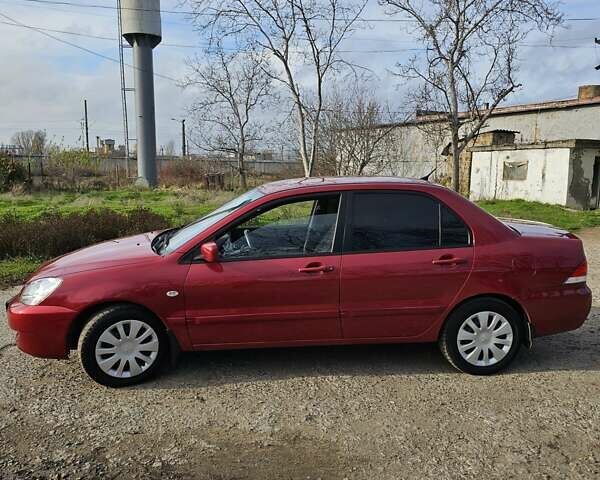 Червоний Міцубісі Lancer, об'ємом двигуна 1.6 л та пробігом 220 тис. км за 5800 $, фото 6 на Automoto.ua