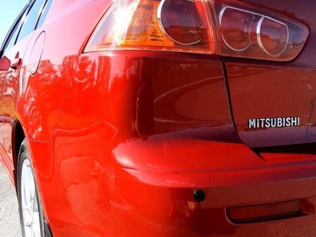 Красный Мицубиси Лансер, объемом двигателя 2 л и пробегом 110 тыс. км за 7500 $, фото 8 на Automoto.ua